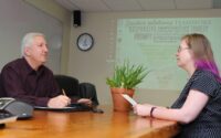 Mediation and litigation support - two people at a conference table