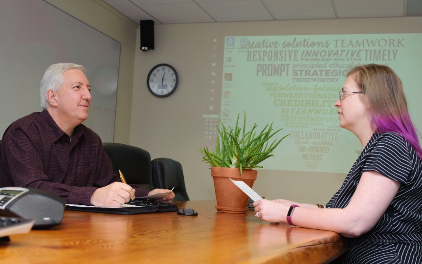 Mediation and litigation support - two people at a conference table