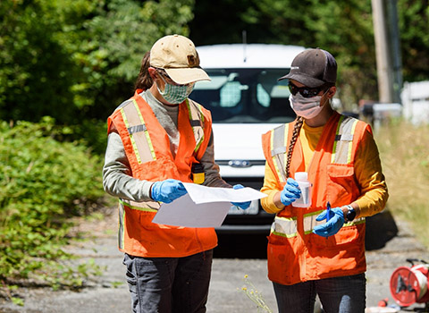 Two female Farallon employees conducting an environmental evaluation