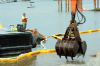 Crane arm hovering over water