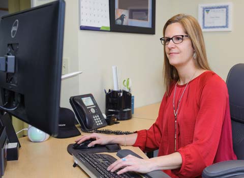 woman sitting at a desk