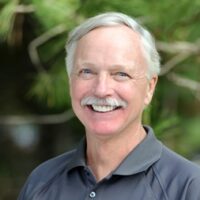 smiling-farallon-employee-with-short-gray-hair-and-mustache