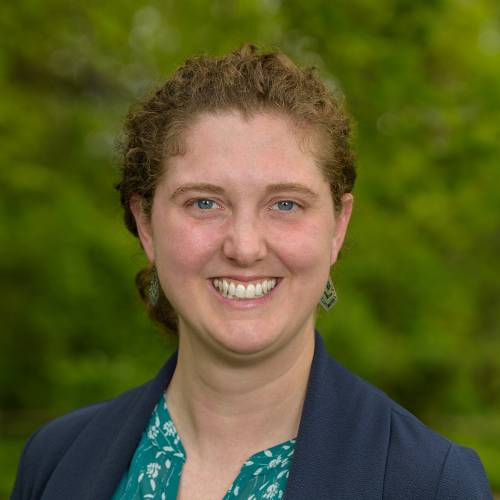 smiling-farallon-employee-with-curly-brown-hair