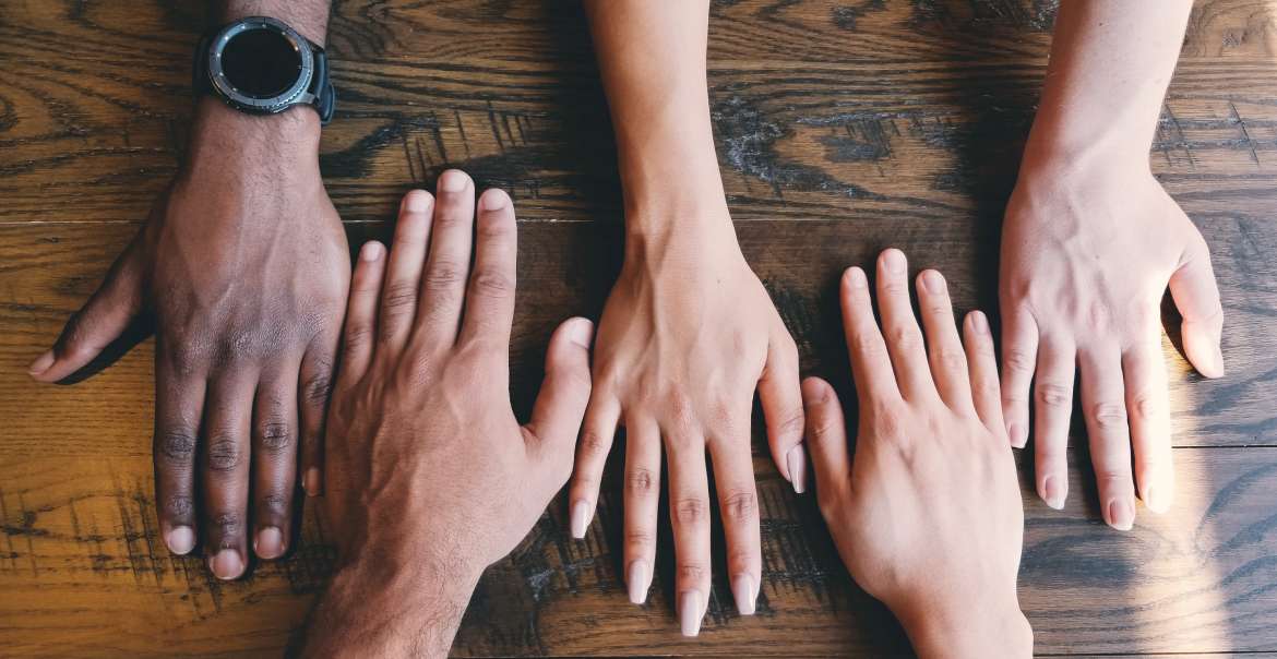 Diverse hands together