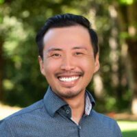 smiling-farallon-employee-with-short-black-hair-and-goatee