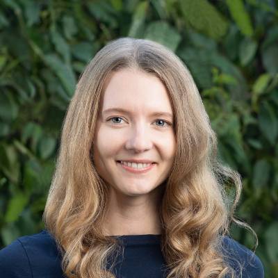 smiling-farallon-employee-with-long-blond-curly-hair