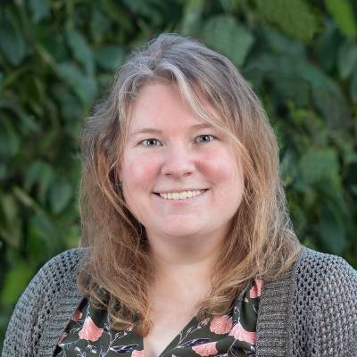 smiling-farallon-employee-with-wavy-shoulder-length-hair