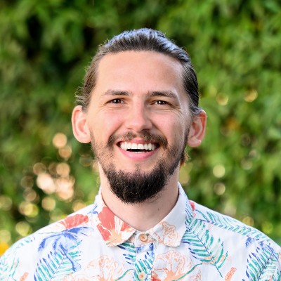 smiling-farallon-employee-with-dark-beard-and-floral-print-shirt