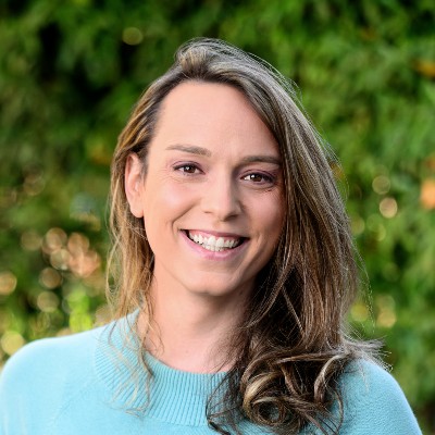 smiling-farallon-employee-with-long-brown-hair-and-blue-sweater