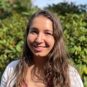 smiling-farallon-employee-with-long-curly-brown-hair